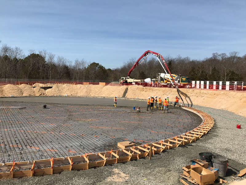 Circular reinforced concrete pad with rebar mat and edge forms set