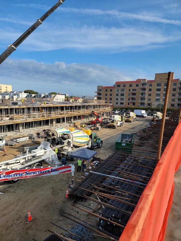 Aerial view of formwork and rebar with mixer trucks alongside