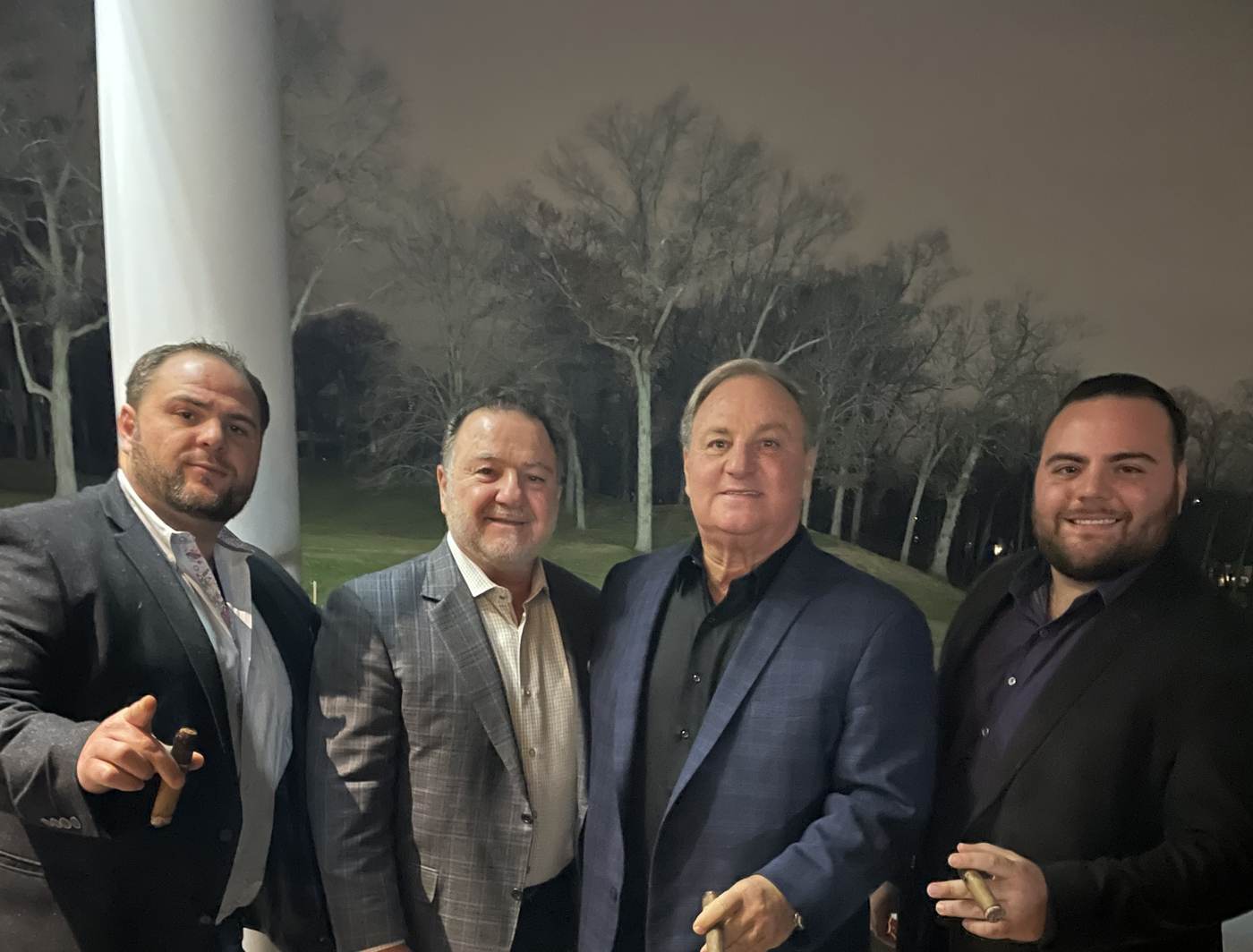 Four members of the Nicolia family together at an evening event